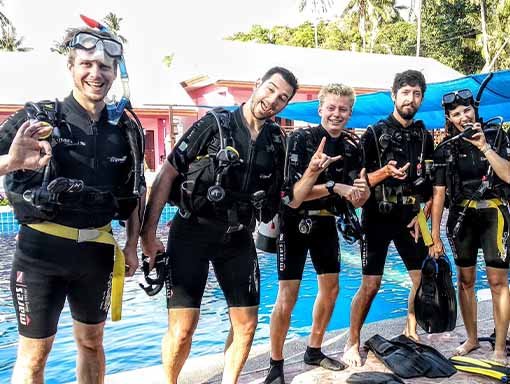 PADI Open Water Course happy divers swimming pool