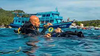 Stress and Rescue Course diver performing rescue breaths on unconscious diver on Koh Tao
