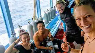 Sidemount Specialty divers preparing equipment on the Crystal Dive boat
