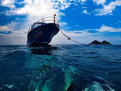 crystaldive.com-extend-your-limits-package-boat-blue-water