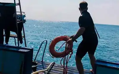 Crystal Dive Stress and Rescue student throwing floatation device
