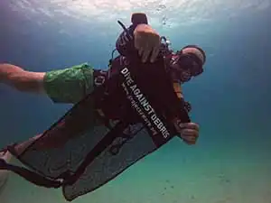 The Coral Tribe diver collecting debris from dive sites around Koh Tao Thailand