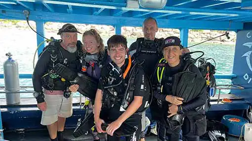The Coral Tribe marine conservation divers on the Crystal Dive boat near Koh Tao