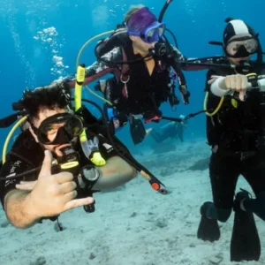 Instructor supervising improve your skills students doing a navigation dive near Koh Tao Thailand
