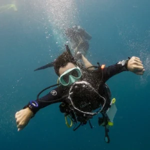 Open Water Course instructor making bubble ring
