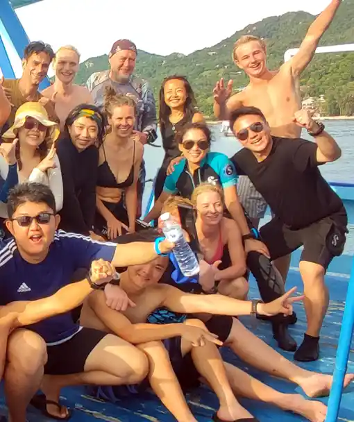 SCUBA diver course happy divers celebrating after their first dives