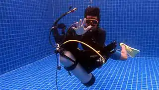 Instructor Training Course candidate performing skill in the pool