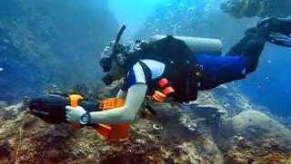 Diver Propulsion Vehicle DPV Specialty course diver scootering around the waters of Koh Tao