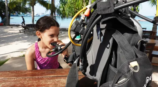 SSI Explorers participant testing a scuba regulator