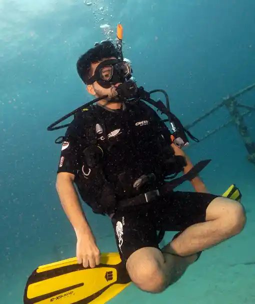 Diving Student practicing a hover in the perfect buoyancy specialty course at Crystal Dive Koh Tao