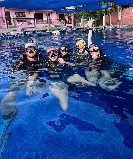 Divers in the pool as part of the SCUBA Refresher Course Thailand