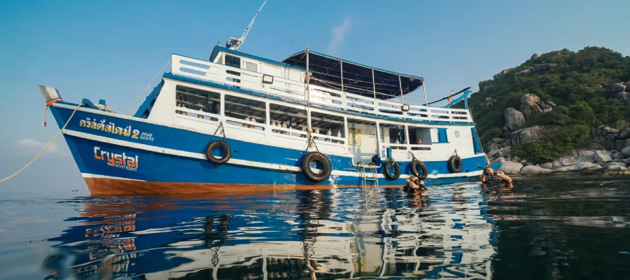 working as a divemaster in the water around the boat on Koh Tao