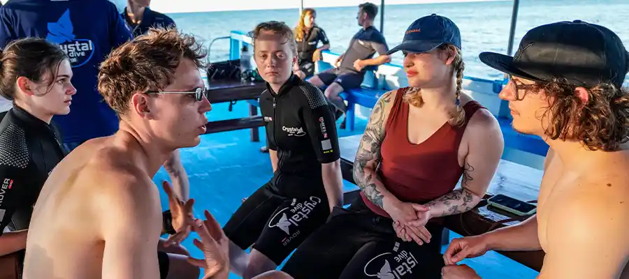 Dive Instructor giving briefings on the boat and using scuba diving slang