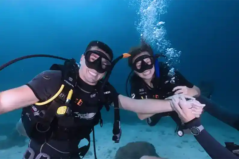 Basic Divers underwater having fun
