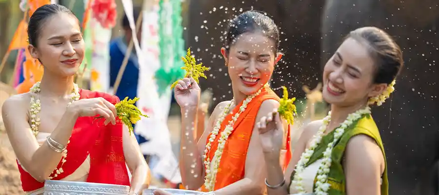 Thai ladies water splashing on Songkran