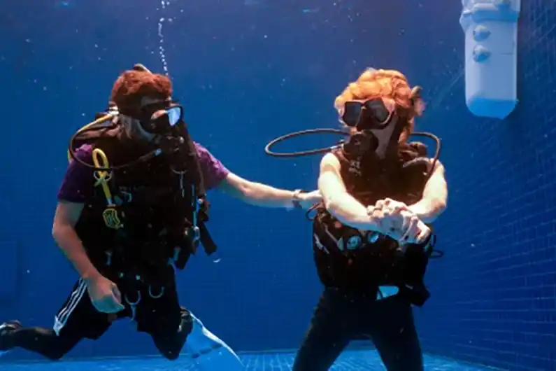 assistant instructor trainer course candidate demonstrating in the Crystal Dive pool