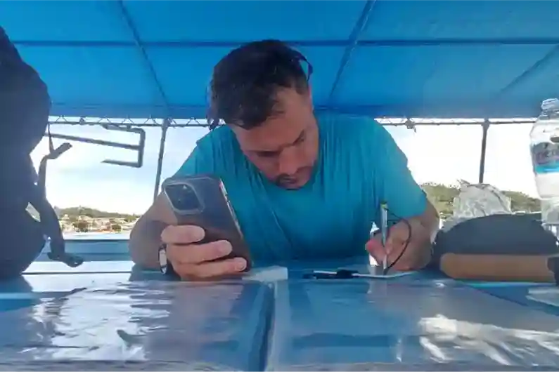 Crystal Dive Independent Diving Specialty student planning dive on the boat prior to the dive