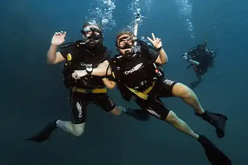 Crystal dive buddys having fun underwater on Koh Tao