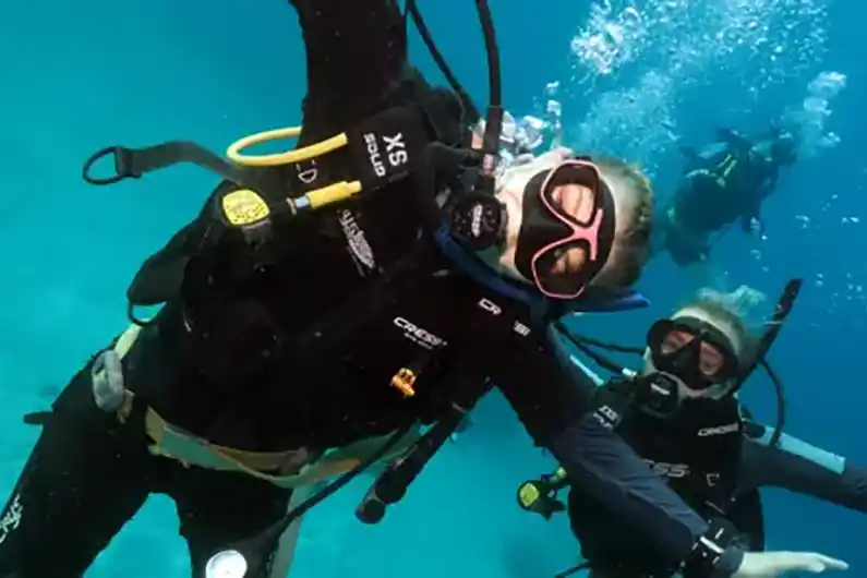 Two Crystal Dive students having fun underwater