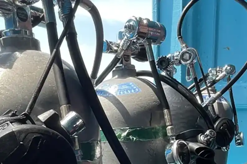 sidemount diving specialty course tanks on the boat