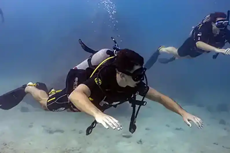 Crystal Dive divers practicing their trim in the water on Koh Tao