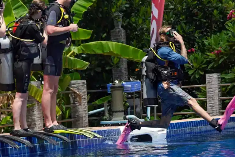 Crystal Dive Scuba Diver Course Instructor And Students Giant Stride At Big Pool Koh Tao Thailand