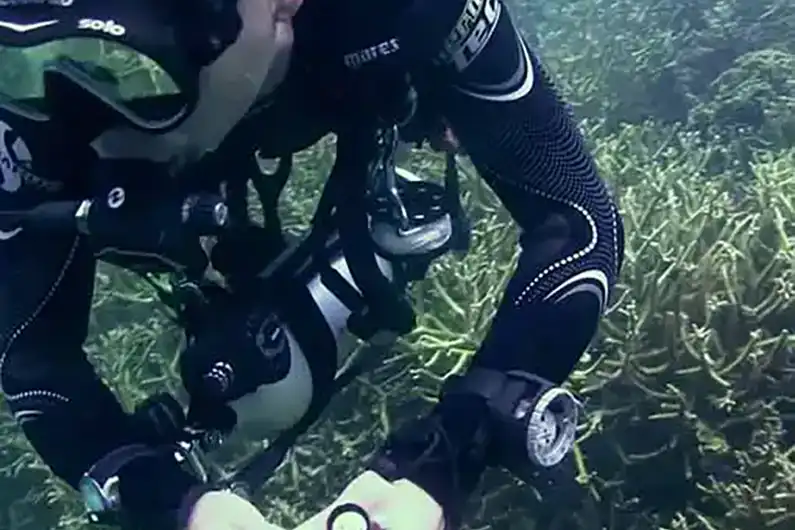 Crystal Dive independent diver with pony tank underwater