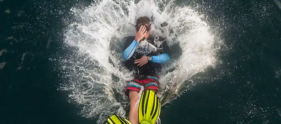 chronicles suncream and scuba dive entry Diver entering the water from the dive boat